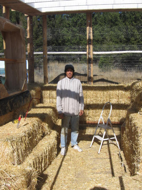 Chris with local straw bales.